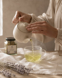 Pouring Calm and Balance tea — steaming postpartum wellness infusion