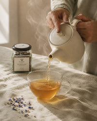 Pouring Nurture and Nourish tea — steaming lactation support infusion
